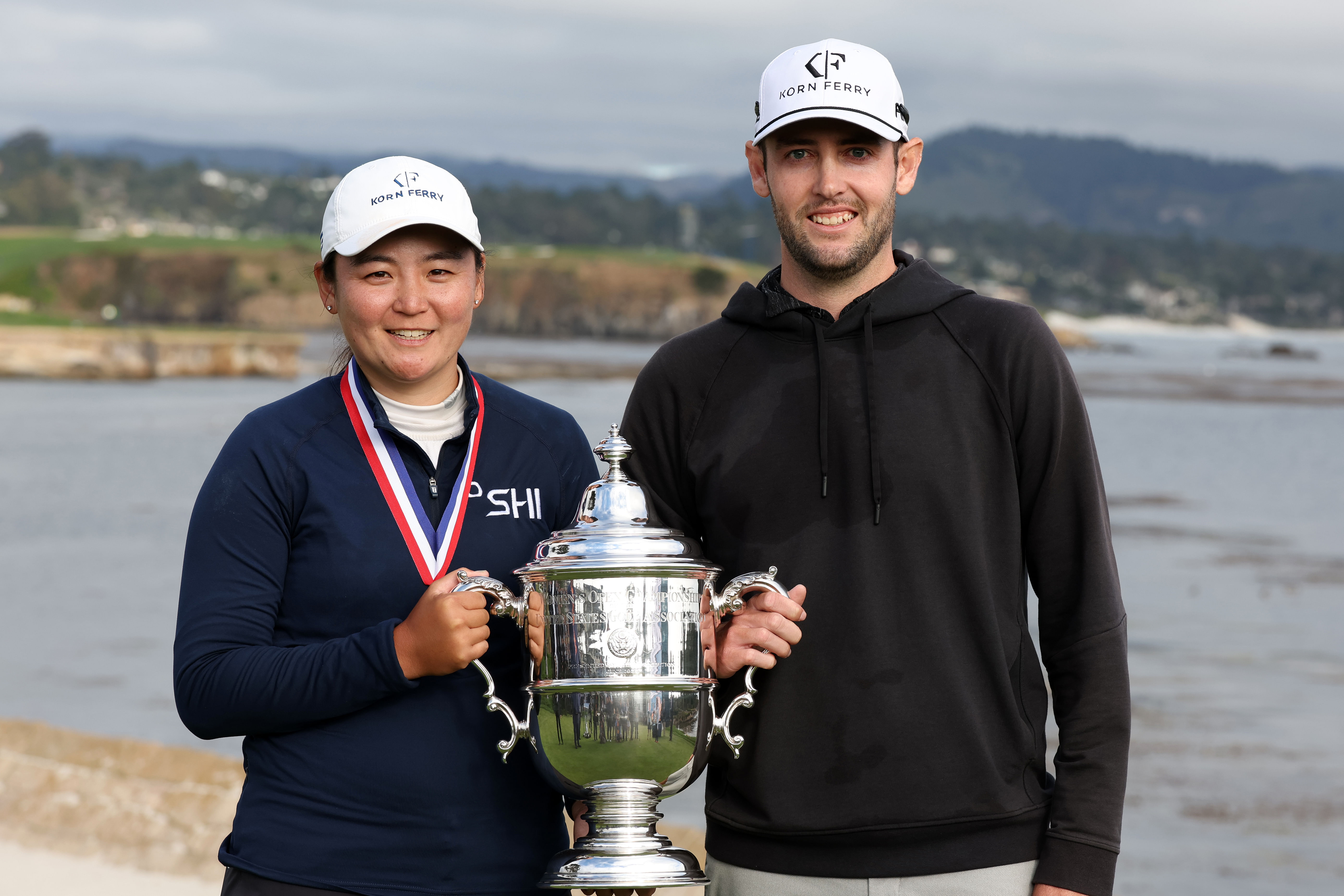Allisen Corpuz and her caddie Jay Monahan celebrate with the Harton S. Semple Trophy (Source: Imagn)